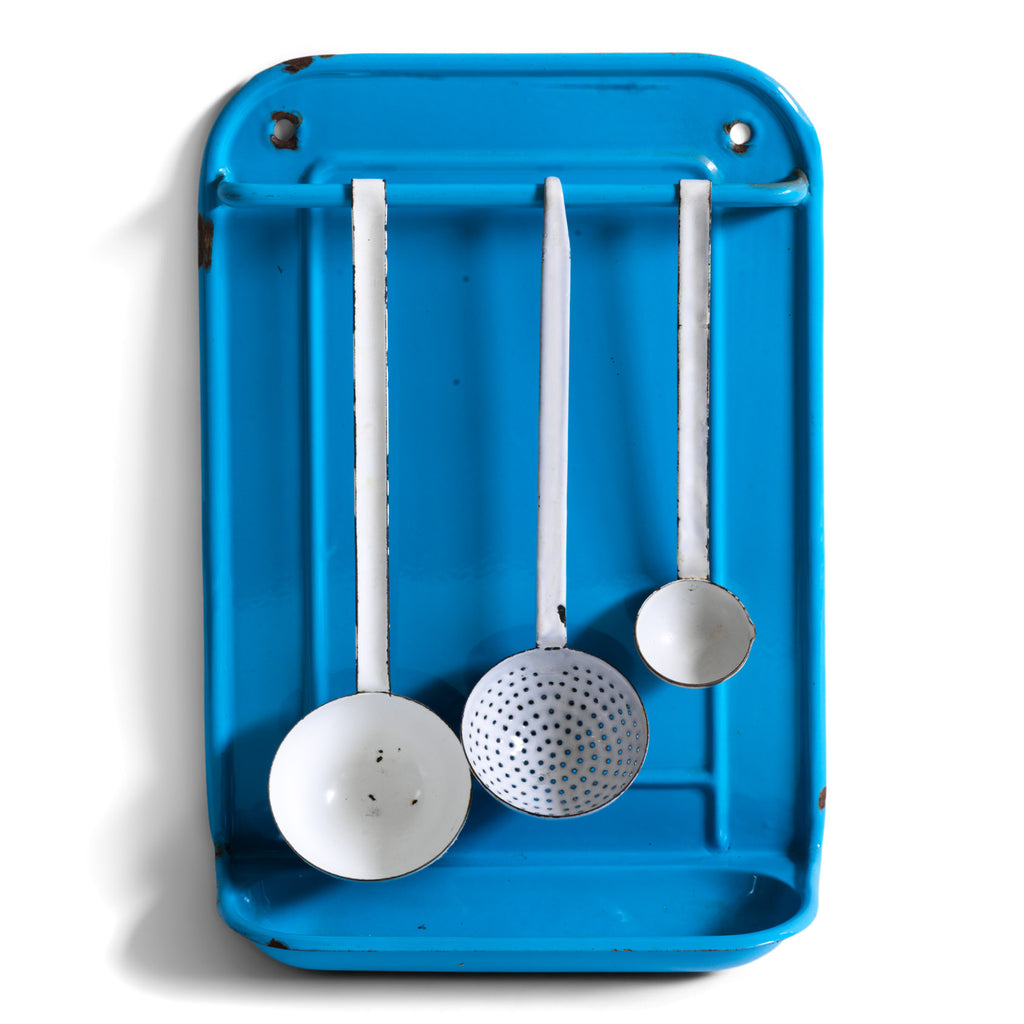 A vintage blue enamel kitchen utensil wall-mounted rack and drainer, ideal for the hanging of ladles, scoops and spoons, and manufactured by Kockums of Sweden.