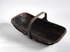 An extra-large rustic antique trug, with a particularly pleasing historic sheet-metal repair to its interior, and a lovely patina formed from decades of use.