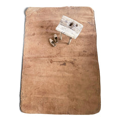 A large soft leather mat with lovely time-worn patina, converted from a 1930s gym mat.
