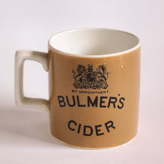 An antique Mochaware Bulmer's half pint cider pub mug, with the royal crest of a unicorn and lion, and "Bulmer's cider by appointment" to the crown, represented on both sides of the mug.