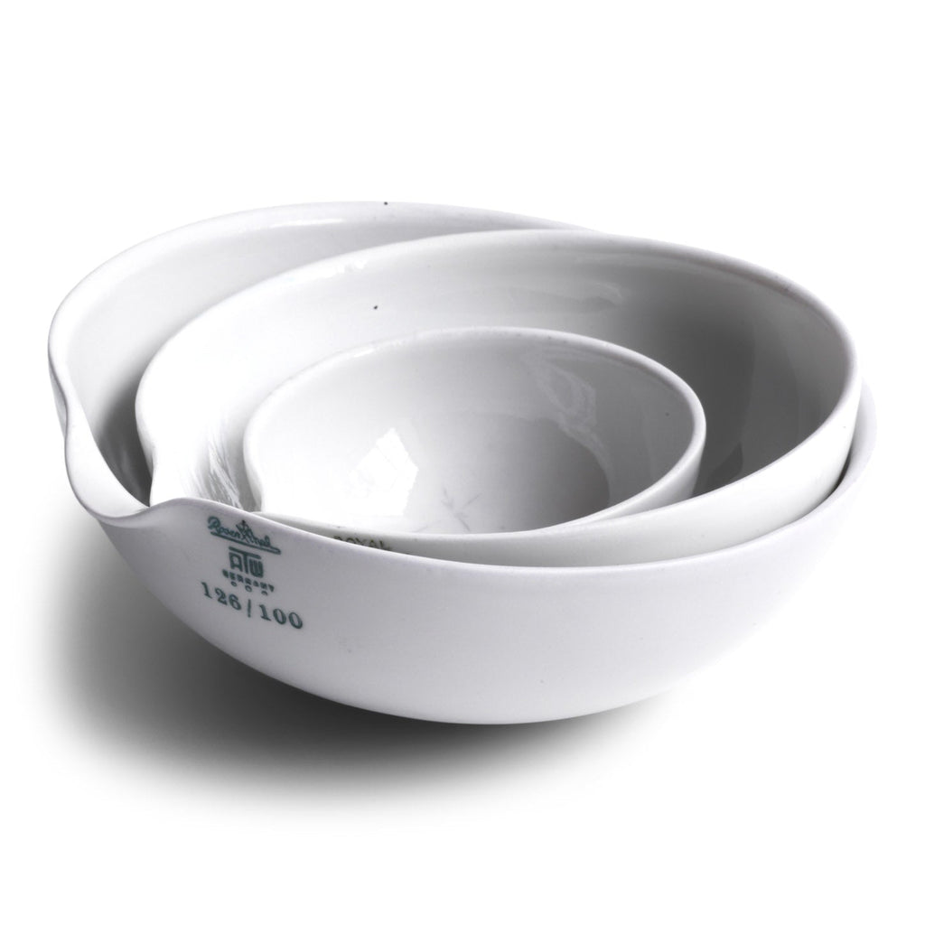 These perfectly formed vintage porcelain pouring dishes are the perfect kitchen-to-table vessels for olive oil, sea salt and crushed black pepper. Once used in a chemist's laboratory, these crucibles are now perfectly suited for condiments at the dining table. 