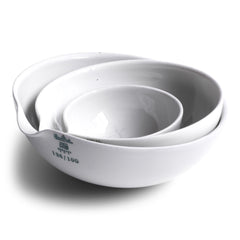 These perfectly formed vintage porcelain pouring dishes are the perfect kitchen-to-table vessels for olive oil, sea salt and crushed black pepper. Once used in a chemist's laboratory, these crucibles are now perfectly suited for condiments at the dining table. 