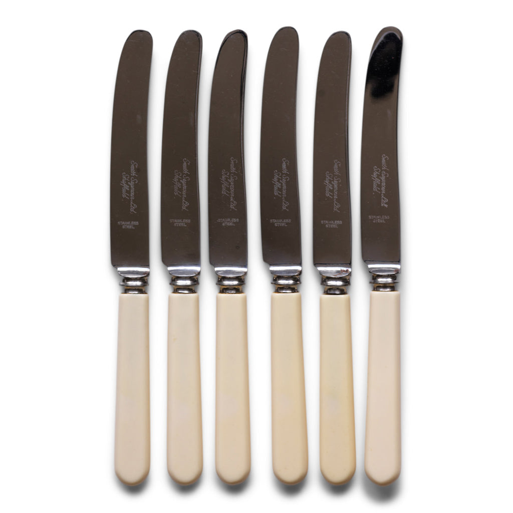 A set of 6 vintage bone handle cake knives or sandwich knives, each blade marked "Smith Seymour Ltd Sheffield".