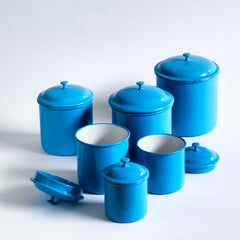 A set of vintage blue enamel storage jars or tins with particularly elegant lids made by Kockums, in Sweden. 