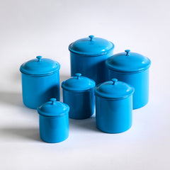 A set of vintage blue enamel storage jars or tins with particularly elegant lids made by Kockums, in Sweden. 
