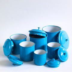 A set of vintage blue enamel storage jars or tins with particularly elegant lids made by Kockums, in Sweden. 