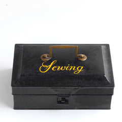 A charming Victorian tin with "Sewing" sign-written in yellow-gold italic font to its lid. Perfect for the storing of all your sewing bits and pieces - from braids and cottons, to scissors, needles and buttons. It has an elegant brass carrying handle, and a hasp, and the lid is beautifully chamfered on all sides.