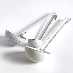 A collection of three vintage enamel kitchen ladles: a scoop with a perforated bowl - perfect for the singling out poached or fried food and draining; a large ladle, and a small sauce ladle with a handy pouring lip - and also ideal for gravy.