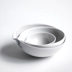 These perfectly formed vintage porcelain pouring dishes are the perfect kitchen-to-table vessels for olive oil, sea salt and crushed black pepper. Once used in a chemist's laboratory, they are now perfectly suited for condiments at the dining table.  