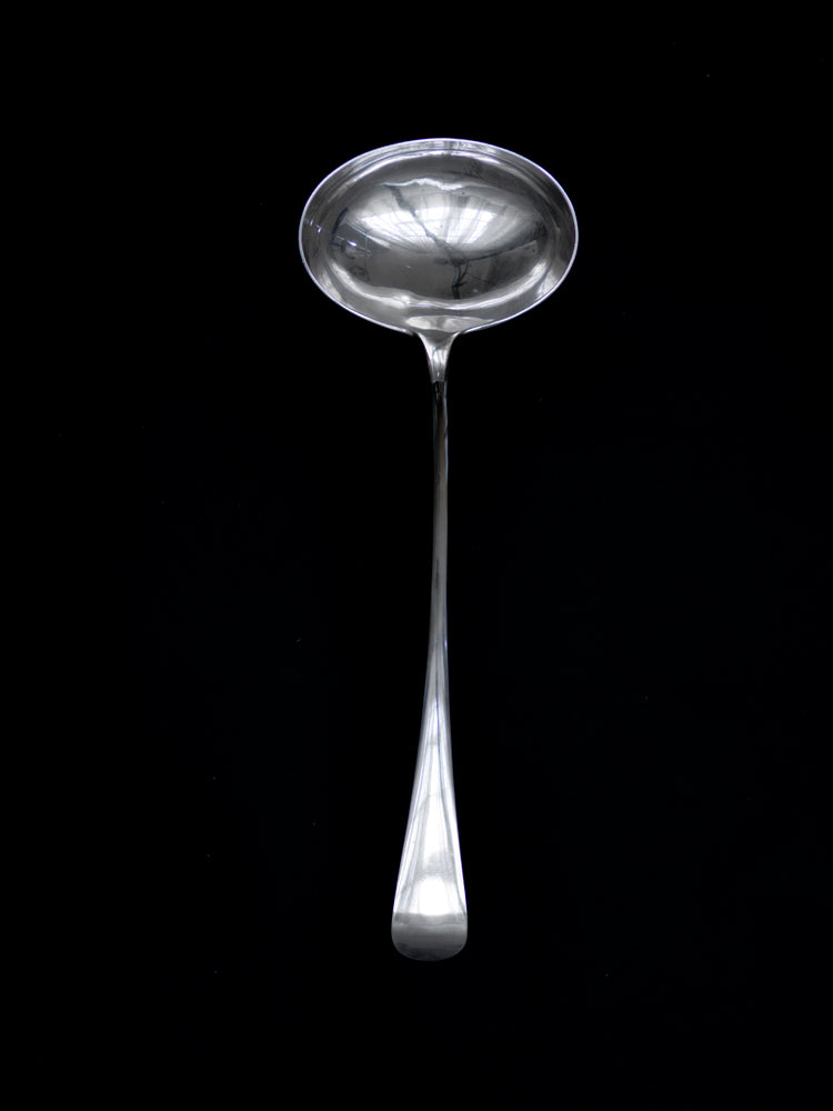 A large Harrods silver-plated ladle by James Dixon & Sons  This well-proportioned and beautifully designed ladle has an elegant bow-arched handle and would sit well alongside a tureen of soup or bowl of festive punch.  It was retailed through Harrods in the early part of the twentieth century, verified by its Harrods hallmarks.