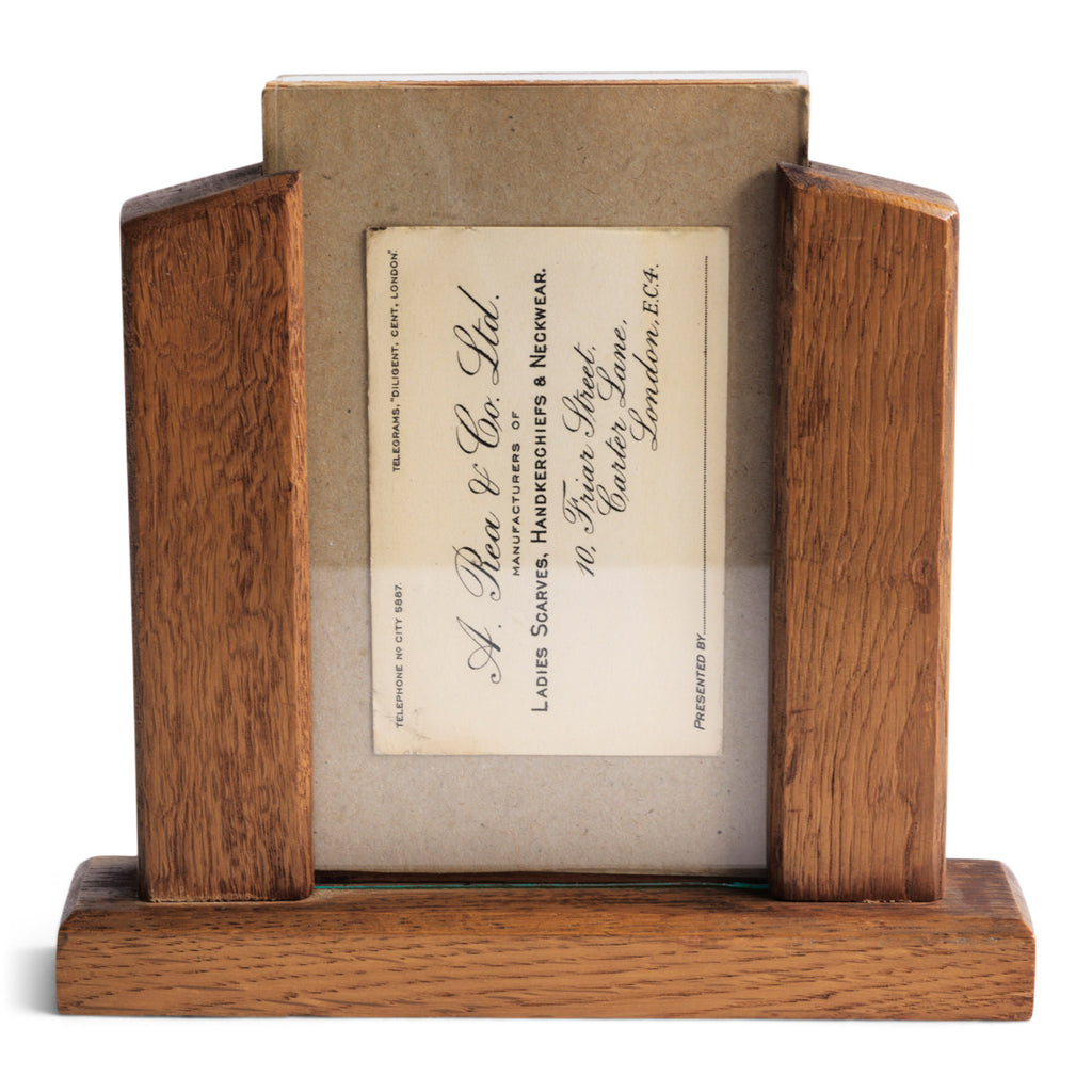 A good 1930s oak photo frame in the Art Deco style with glass front and plywood back.