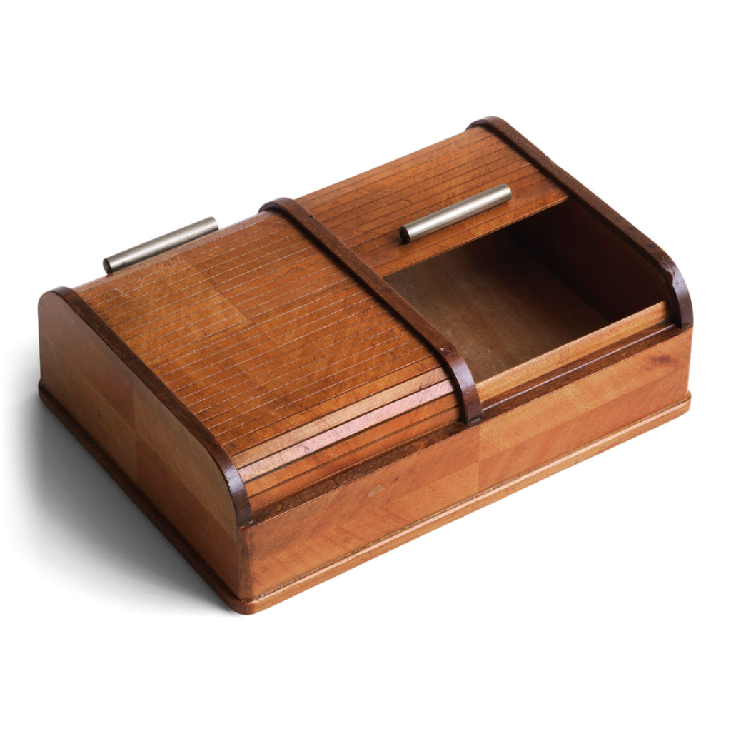 A very pleasing and handy little box with a twin tambour roll-top lid, each with a streamline metal pull handle.