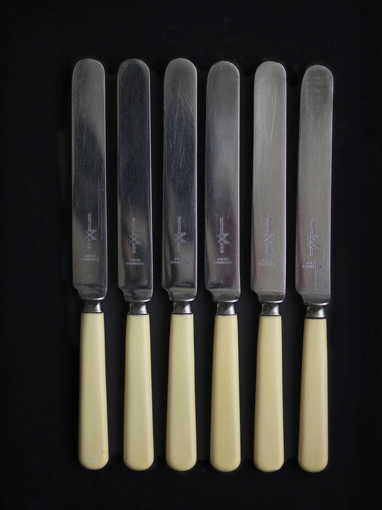 Set of 6 vintage Battle Axe dinner knives with ivorine handles and stainless steel blades 