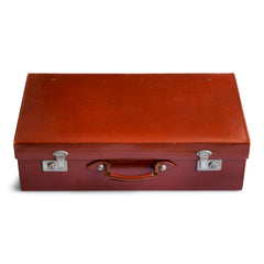 1940s ox-blood leather suitcase with good squared corners. The leather is stamped "Guaranteed selected hide, hand closed" and there are five studs affixed to the underside - to protect the leather when the case is opened and in use.
