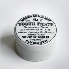 We have sourced a small collection of Victorian chemist's tooth paste pots with lids.  Each lid is exquisitely designed and bears all of the proprietor's information in black and white: "Woods Areca Nut 6d Tooth Paste - For removing Tartar and whitening the Teeth without injuring the Enamel. Propretor W. Woods Chemisy Plymouth"