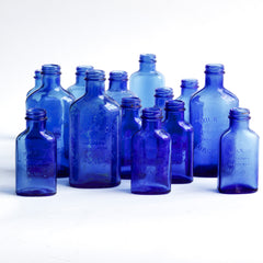 A collection of cobalt blue milk of magnesia bottles in three sizes, each moulded "Milk of magnesia registered trade mark".  Rescued from a Victorian bottle dump, they have been cleaned and scrubbed, and their wonderful cobalt blue colour brought back to life. 