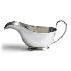 A silver plated officer's mess gravy boat made by William Bruford & Son in 1961.   This well-proportioned, well-balanced and beautifully designed gravy boat is a joy to use and is the making of a good meal.  Our vintage silver-plated EPNS (electro-plated nickel silver) dinner ware is both good-looking and functional, and its renewed popularity make it a stylish addition on today’s table. It's broad arrow mark located on its underside (see image) designates its military origins.