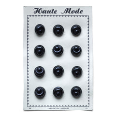 We have several of these "Haute Mode" black buttons mounted on their original sales card. Each circular button is shaped like a mini bread roll and there are 12 in total on each card.