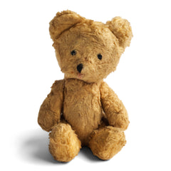 A vintage 1950s baby teddy bear made from a classic shade of gold mohair plush; and although much loved, he is still in great condition. He has black glass eyes, with an embroidered nose and mouth. His head is fixed; he has swivel jointing to his little arms and legs; and he is stuffed with his original wood-wool. And he's a little bundle of joy.