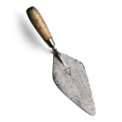 A steel trowel with pine handle with maker's name "Lawson & Meaton cast steel" stamped into the steel. A wonderful object in its own right, and it would look great on a desk used as a paper weight.