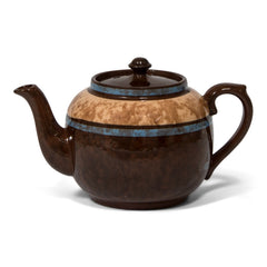 A  striking 3-4 cup original vintage Brown Betty teapot with striking blue marbled banding. Original Brown Betty teapots are distinguished by two common characteristics: their red Etruria Marl clay, and a rich brown manganese glaze known as Rockingham. The clay is unique to Stoke-on-Trent, Staffordshire, UK.