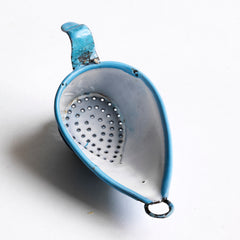 A miniature enamel sieve, part of A miniature enamel jug, part of an extensive collection of pale blue enamel miniature antique kitchen ware, previously owned by the miniaturist specialist and collector extraordinaire Joan Dunk; including, flour scoops, sieve, ewer, grater, saucepan, frying pan and a funnel.