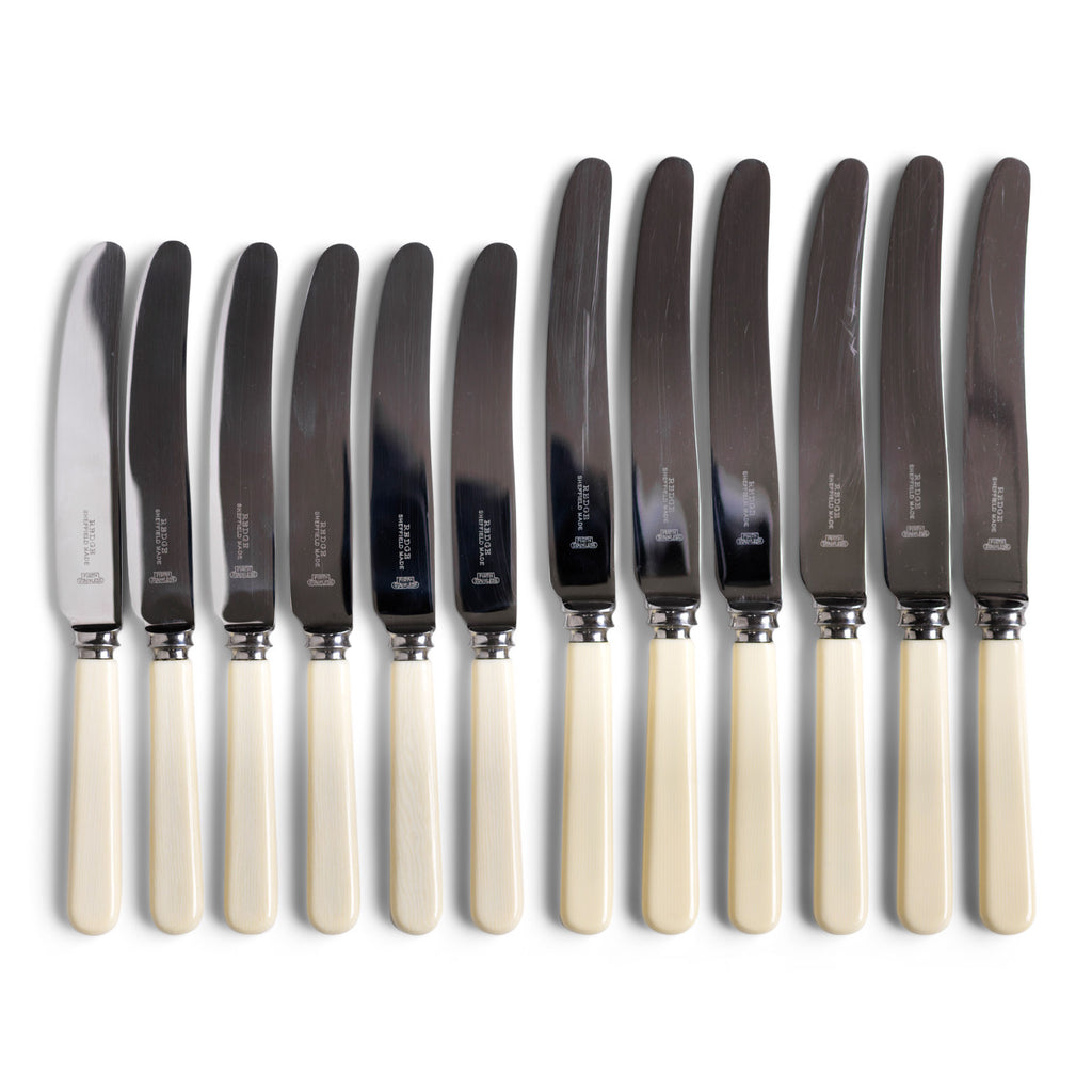 A set of 12 table knives, consisting of 6 dinner knives and 6 matching side knives, each blade marked "Redge Sheffield Made".
