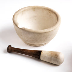 An apothecary's mortar & pestle, of generous size, weighing in at 4.3kg, and dating to the turn of the last century. The mortar and the tip of the pestle is made out of vitrified porcelain, making it durable and very tactile. The pestle has a turned wood handle which has seen the hands of many, crushing powders and tablets for over a century, resulting in a beautifully aged patina.  Underneath it is stamped "Warranted acid proof 3 8 ".