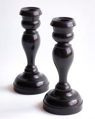 A striking pair of Edwardian ebony candlesticks. 