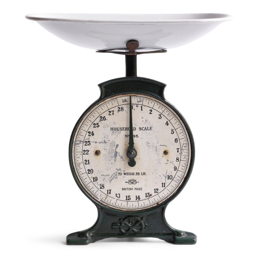 An elegant set of Edwardian weigh scales in cast iron with a detachable white enamelled weighing bowl and with its original dark racing-green painted finish. The dial is marked "Household Scale To Weigh 28lb", and the dial divisions are in imperial lbs and ounces.