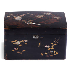 A charming 1920s Japanese lacquered tea caddy inlaid with mother of pearl flowers, leaf sprigs, vine trails, and birds. The bow-topped hinged lid opens up to reveal a further two lacquered boxes with hinged lids which are removable, as shown in the images. Length 23cm Depth 12.5cm Height 14cm.
