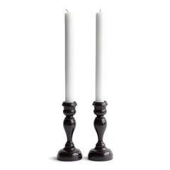 A striking pair of Edwardian ebony candlesticks. 