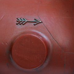 Detail of a 1920s iron foundry casting maquette with original oxblood-red paint finish.