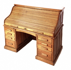 An Edwardian golden oak tambour-front writing desk, with fitted interior, and solid oak fielded (bevelled) panelled sides and back and each pedestal has four fitted graduated drawers, and at the top, two brush slides - desk extension pull-out ledges.