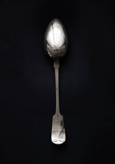 A large Edwardian silver-plated serving spoon with A C monogram and fiddle handle.