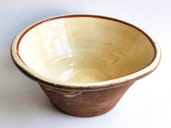 A very good-looking late nineteenth century bread proving bowl with a cream coloured glazed interior and a deep rolled rim.  The delightful glaze smudges on its terracotta exterior add character - and hand-thrown charm. Perfect for the kitchen or the dining table. We think wonderful when filled with vegetables or lettuces.