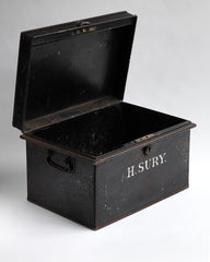 A beautifully proportioned Edwardian document tin with its original lettering "H.Sury" and black paint finish. It has a hinged lid and twin carrying handles.