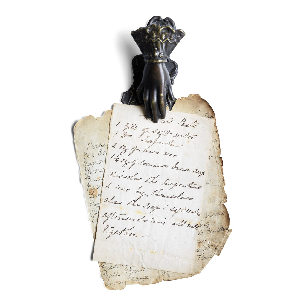 An elegant antique brass clip fashioned as a gloved hand stamped "Made in Birmingham". The back of the clip has a hole, so it can easily be hung on a wall - perfect for keeping and displaying notes, and handwritten treasures. 