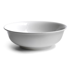 A super large early twentieth century ironstone wash bowl. Plain, unadorned ironstone wash bowls with clean-lines and simple forms were part of everyday 19th and early 20th century below-stairs life . Their purity is as appealing today as it was then and they make an arresting addition to the modern home.