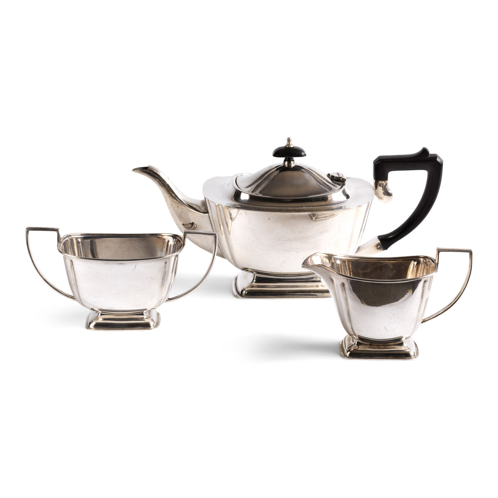 A classic 1930s Regency style silver plated three piece afternoon tea set, consisting of a teapot, milk jug and a twin-handled sugar basin. The teapot has a black Bakelite handle and knop to its lid, and each piece is stamped "EPNS 1285 D&P". Delivers approximately six cups of piping hot tea.