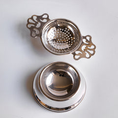 Antique silver plated tea strainer with stand