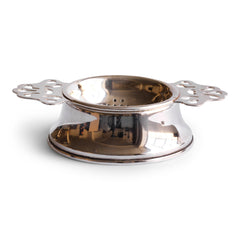 A 1920s twin-handled silver plated tea strainer with stand.  We have had this item re-silver plated, so it is in excellent condition.