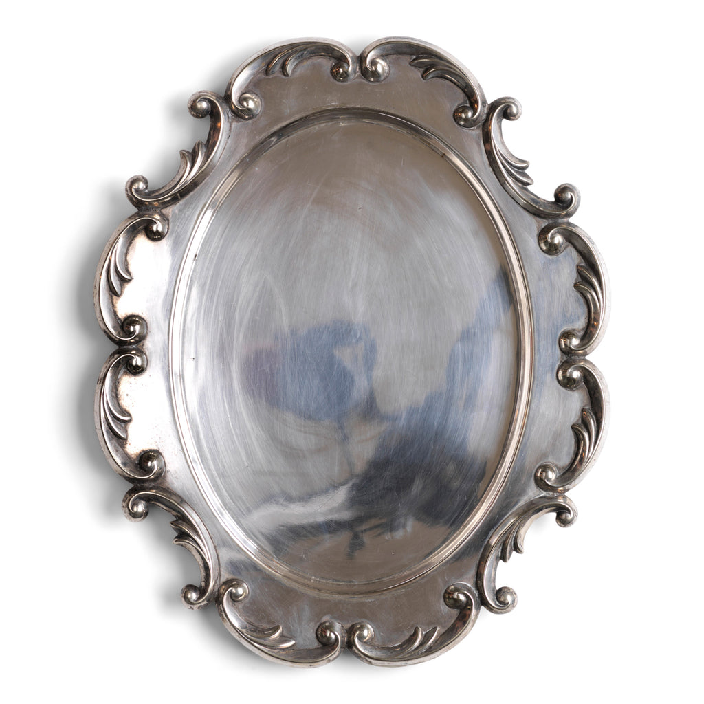 A magnificent 1940s silver-plated salver or platter with raised picture-frame scrolled border. Well-proportioned, with a good weight, and beautifully designed, it would make a stylish addition on today’s table. 