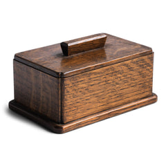 A very pleasing and handy little 1930s tabletop oak box with lid. It has a baize covered underside and so will sit comfortably on your desk or worktop.