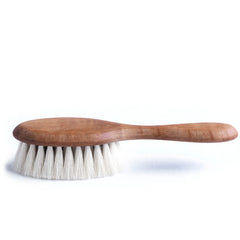 The perfect little pear wood hairbrush for baby and mum.  Hand-tufted with the softest goat hair, it's the kindest and gentlest brush you could dream of - and makes the perfect christening gift. 