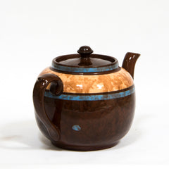 A  striking 3-4 cup original vintage Brown Betty teapot with striking blue marbled banding. Original Brown Betty teapots are distinguished by two common characteristics: their red Etruria Marl clay, and a rich brown manganese glaze known as Rockingham. The clay is unique to Stoke-on-Trent, Staffordshire, UK.