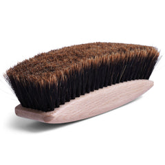 Our handmade butler's brush is made from hand-tufted split horsehair secured in a rounded beechwood handle. Its grooming uses go beyond the brushing down of jackets and trousers, as it can be used for the sweeping of crumbs from the tablecloth or tabletop, or to buff shoes.