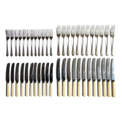 An extensive 1930s Art Deco style silver plated canteen of cutlery by James Dixon & Sons Ltd of Sheffield. The set is for 12 people, contains 87 pieces of cutlery, and comprises of:  12 dinner knives  11 side knives  12 dinner forks  12 dessert forks  12 dessert spoons  12 soup spoons  10 teaspoons  6 serving spoons.