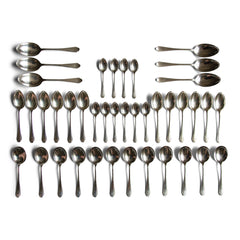An extensive 1930s Art Deco style silver plated canteen of cutlery by James Dixon & Sons Ltd of Sheffield. The set is for 12 people, contains 87 pieces of cutlery, and comprises of:  12 dinner knives  11 side knives  12 dinner forks  12 dessert forks  12 dessert spoons  12 soup spoons  10 teaspoons  6 serving spoons.