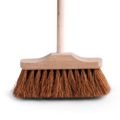 A small, nifty little broom with a narrow beech wood head of coconut bristles and a shorter handle than normal.  Excellent for sweeping in and around nooks and crannies, and between awkward spaces such as chair legs; and it can be readily used outside, for a quick sweep around the the terrace or path.